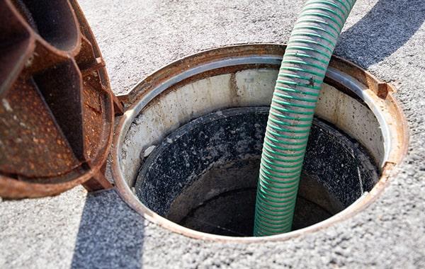 signs that a grease trap needs pumping include slow drainage, foul odors, and visible grease build-up in the trap